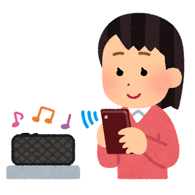 スマホの音楽をスピーカーで聴く女性
